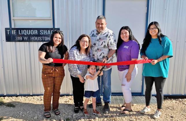 BREW THROUGH The new Liquor SHACK in Floydada, a drive-through shop, held a ribbon cutting Thursday, May 4. From left are Elizabeth Rodriguez, Carol Perez, Ariel Perez, Alfred Perez, Sarah Perez, and Yelitza Serrato.