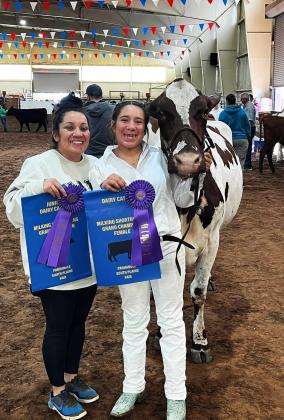 GRAND CHAMPION Congratulations go to Floydada FFA member Aubrianna Martinez (right) on exhibiting the Grand Champion Milking Shorthorn at the Panhandle South Plains Fair. Martinez is a freshman at Floydada Collegiate High School. | FCISD PHOTO