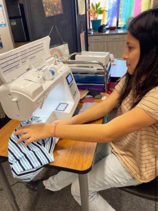 SEWING FROMTHE HEART Jasmine Flores, a student in the high school Fashion Design class, is putting heart and soul into her creations. | FLOYDADA CISD