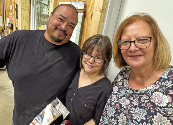 SMILING FACES of Crosby County Fuels staffers Luis Guzman, McAdoo manager, and Chris Hunt and Freda Hitt of the home office in Ralls.