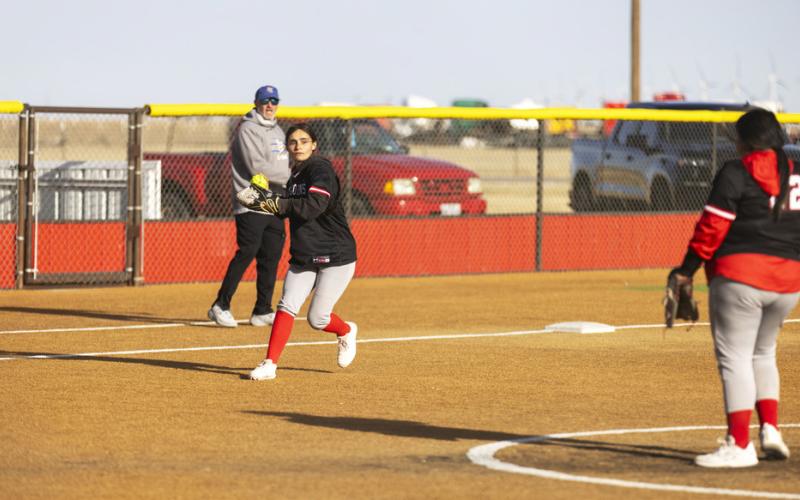 Siya Salazar fields a grounder.