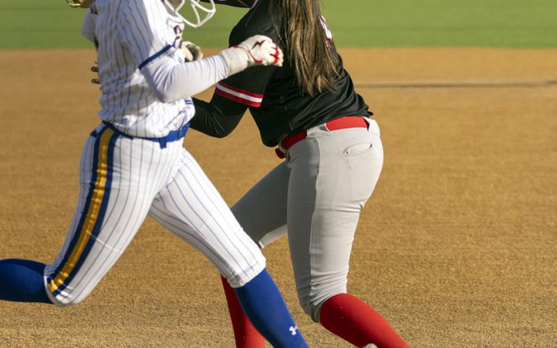 Lily Jimenez beats the runner to the base.