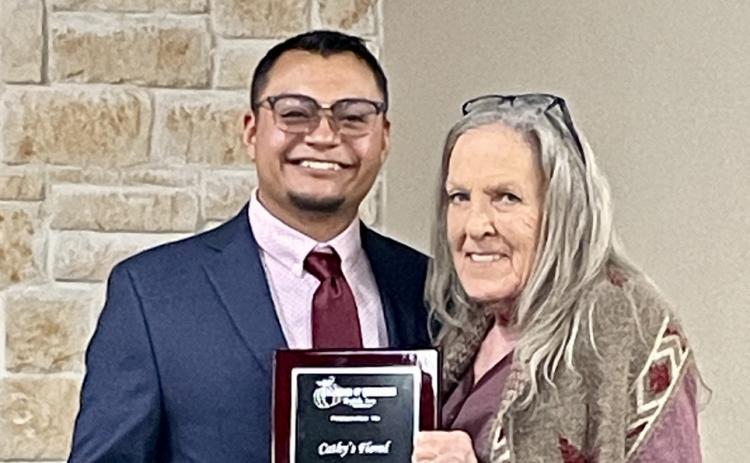 CATHY'S FLORAL Cathy Graham (right) was honored as the Floydada Chamber's Business of the Year. She has been providing floral arrangements and gifts for more than 20 Years. Chamber manager Isaac Martinez presented the plaque. | HESPERIANBEACON