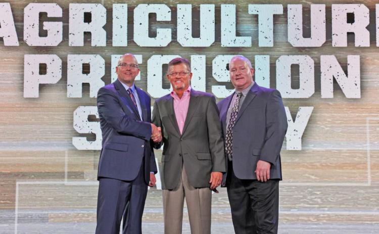 REIN-MAKERS Agriculture Precision Supply recognized by Reinke Manufacturing Company. Shown from left, Reinke President Chris Roth, Mark McCormick and Joe O’Brien, Central Region Territory Manager (South). | COURTESY PHOTO