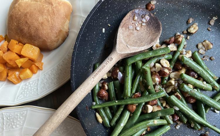 FRESH AND FANCY Fresh green beans seasoned with a garlic are wonderful for our typical dinners, but for the holidays, fresh greens beans accented with shallots and toasted hazelnuts take plain green beans from average to fancy. | ANGELINA LaRUE PHOTO