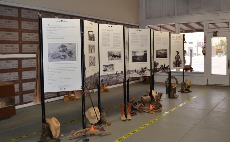 AT THE MUSEUM “Vaquero: Genesis of the Texas Cowboy,” currently on display at the Floyd County Historical Museum, features photographs by the late Bill Witliff with narrative text that reveal the muscle, sweat and drama that went into roping a calf in thick brush or breaking a wild horse in the saddle. | FCHM PHOTO