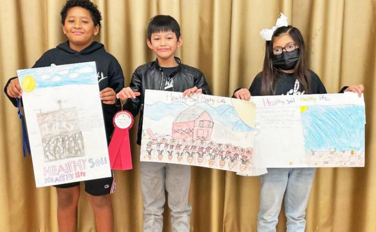 Above, from left, fourth grade winners were Derrick Henderson, first place; Lee Henry Mao, second place; and Paulina Ramirez, third place.