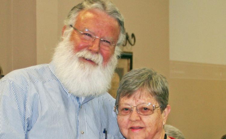 RSVP HONORS – Rodney Watson, advisory board member, hands Ethelyn Vernon her certificate as she was recognized for her service last week to the Retired and Senior Volunteer Program.