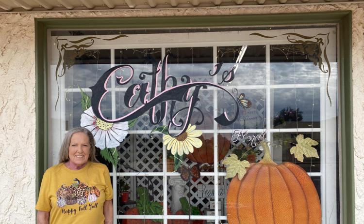 REMEMBERING CATHY The late Cathy Graham is shown in this photo in front of her store. The operations of Cathy's Floral and Gifts has now been taken over by her longtime best friend, Candy Edwards. | COURTESY PHOTO