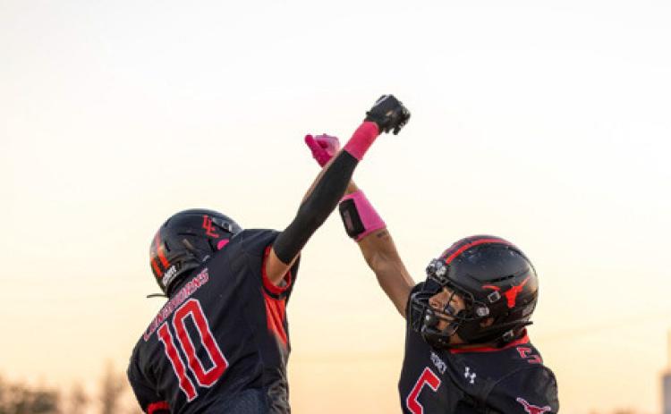 PINK OUT SHUTOUT Lockney’s varsity football team and fans showed unity in the fight against a deadly disease with October Breast Cancer Awareness Month pink on Oct. 9. The Longhorns went on to defeat Pathway Academy 60–0 in their first district game. | CERVANTES PHOTOGRAPHY