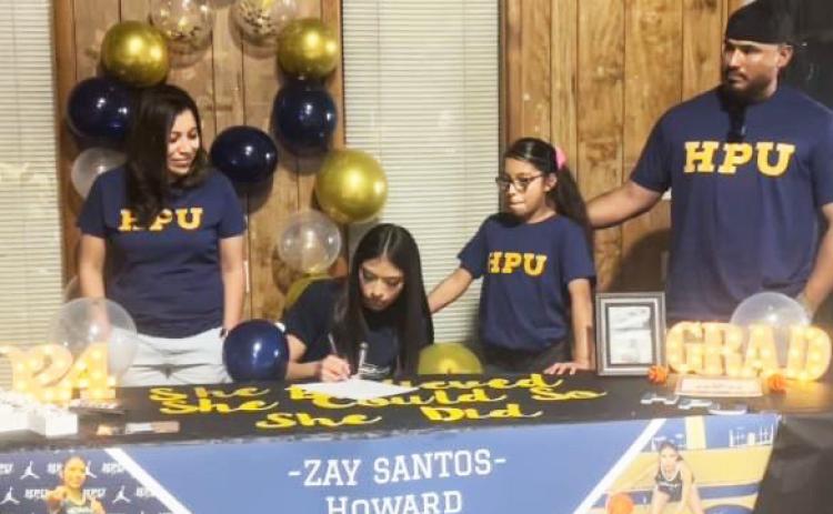 LETTER OF INTENT The Lady Winds’Zay Santos signed her letter of intent with Howard Payne University to play at the next level with the Lady Jackets basketball program. From left: Cynthia Santos, Azaylee (Zay) Santos, Aliana Santos and Jerry Santos. | COURTESY PHOTO