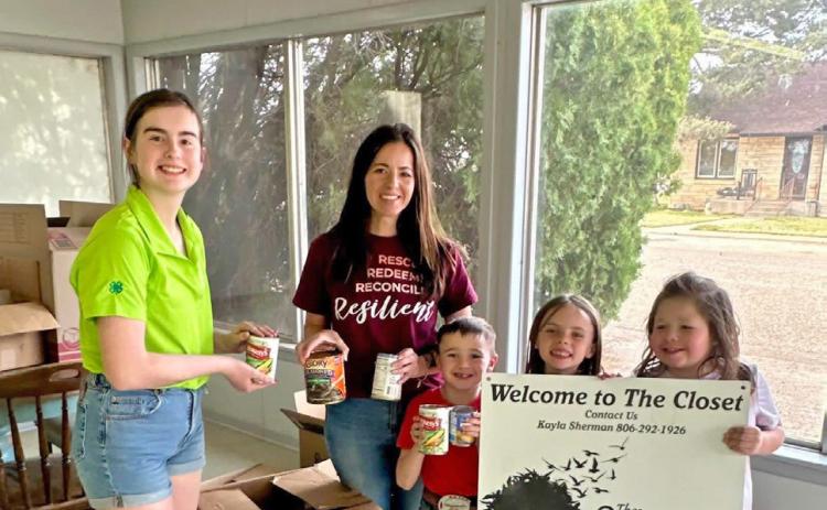 THE OUTCOME Helping out at The Outcome are Ella Snowden (green shirt), Kayla Sherman (maroon shirt), and the children are Thoma, Aubrey and Aspen Sherman. Ella Snowden organized the delivery of donated items to the Outcome Closet. | COURTESY PHOTO