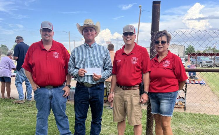 IN APPRECIATION Floyd-Briscoe County Farm Bureau presented the Silverton Volunteer Fire Department with a $5,000 donation. Giving and receiving the donation are, from left, Kody Rhoderick, VFD assistant chief; Farm Bureau representative Chance Rhoderick; JoDee Robinson, VFD chief; and Norma Trevino, fire department secretary. | COURTESY PHOTO