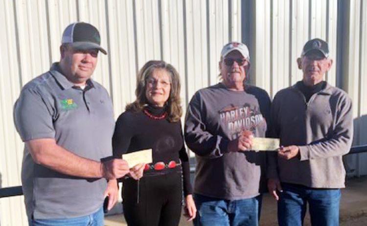 DANCIN’ FOR DOLLARS Floydada Fire Chief Chad Guthrie and Lockney Fire Chief Donny McGlaughlin accept checks from Wendell and Dustee Sollis. Each department was given $10,000.00 from the proceeds of the Eighth Annual Country Christmas Ball. | COURTESY PHOTO