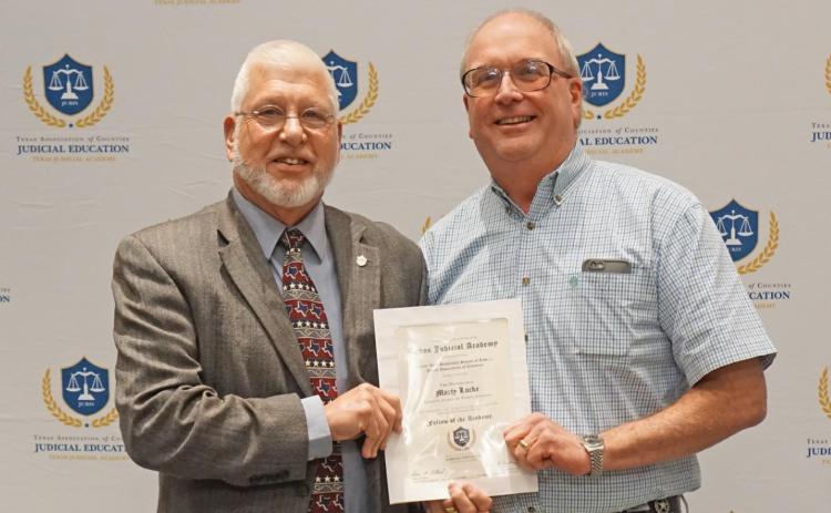 A FLOYD COUNTY JUDGE MARTY LUCKE (right) was honored at the 2021 Fall Judicial Education Session. Byron Ryder, Leon County judge and member of the TAC County Judges Education Advisory Committee, welcomed Lucke as a Fellow of the Texas Judicial Academy. | COURTESY PHOTO