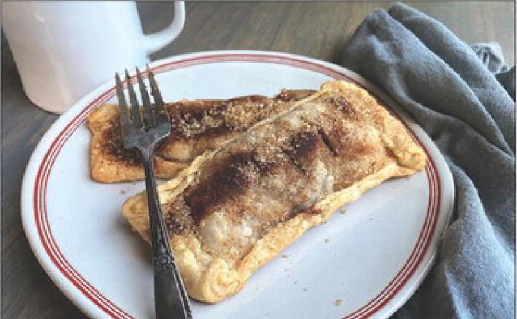 BAKED, NOT DEEP-FRIED A flaky crust filled with crisp apples and chewy dates is a winning combination for a hand pie, topped with cinnamon and crunchy turbinado sugar. | ANGELINA LARUE photo
