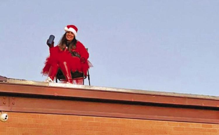 ELF ON THE ROOF? Lockney Elementary got into the holiday spirit earlier this week when they put the principal on the roof to welcome students. See more holiday cheer from Lockney when you read the Santa Letters from Lockney students in Section B. | COURTESY PHOTO