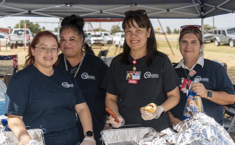 HOSPITAL HELPERS HOST IN HEAT Staffers from Lockney’s WJ Mangold Memorial Hospital and West Texas National Bank assisted with serving a hamburger supper during the city’s July 23 KCBD Channel 11 Community Coverage event. The school district and local businesses were featured at the gathering in the city park—where proximity of the city swimming pool was a popular antidote to triple-digit temps. SPOTLIGHT PHOTOS, PAGE 8 | CERVANTES PHOTOGRAPHY