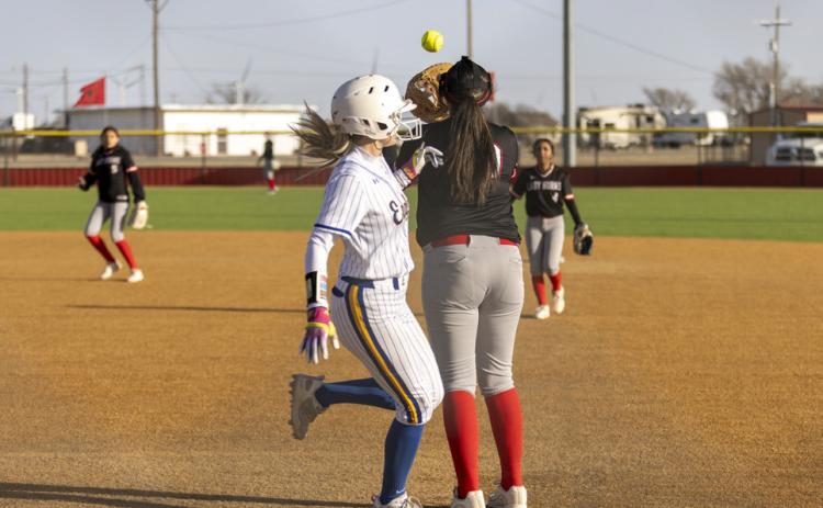 Jasmine Gonzales’ throw to Lily Jimenez just misses the out