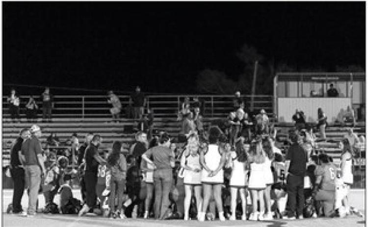 PRAYERS FROM BOTH SIDES The score stood at 28–21 in favor of the Plains Cowboys when Plains’ #9 suffered a concussion and play was suspended. Plains ISD’s Facebook page the following day explained,“Everything is good. Concussion only and releasing him tonight and he is going home.” MORE PHOTOS, PAGE 12 | CERVANTES PHOTOGRAPHY