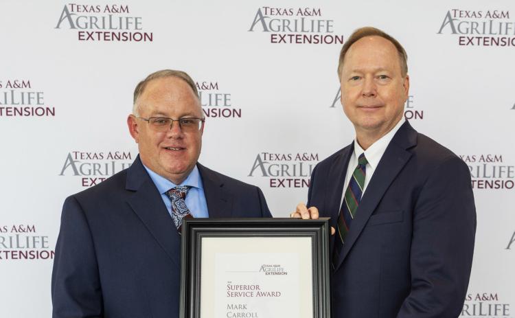 MARK CARROLL (left) recently received County Extension Superior Service Award from Dr. Rick Avery, director of Texas A&amp;M AgriLife Extension Service. | COURTESY PHOTO