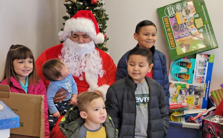 SPIRIT OF GIVING The Lockney Salvation Army distributed baskets to senior citizens on Friday, Dec. 17 and to families on Saturday, Dec. 18 along with Santa giving toys to children. . | COURTESY PHOTO