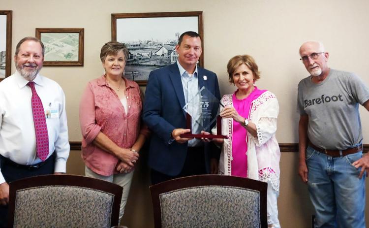 75-YEAR MEMBERSHIP W.J. Mangold Hospital was presented with an award at the regular board meeting on June 26 for being a member of the Texas Hospital Association for 75 years. Standing with the award are, from left, hospital CEO Vince DiFranco and board members D’Lyn Morris, Chris Felton, Becky McPherson and Marlon McDonald. | COURTESY PHOTO.