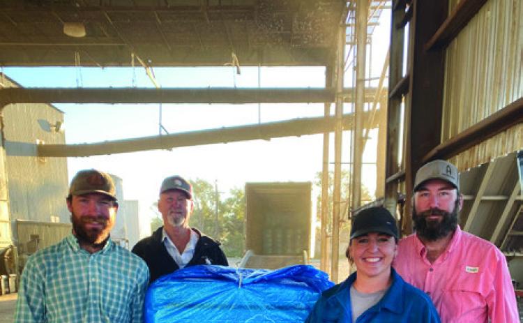 FIRST BALE OF COTTON ginned in Floyd County and Floydada this year was from producer Matthew Rainwater. McCoy Gin ginned the bale at 10:36 a.m., Saturday, Oct. 14. Shown are (back row, from left) gin manager Andy Rainwater and co-producer Matthew Rainwater; (front row, from left) harvester Logan Everett and co-producer Kember Rainwater. | COURTESY PHOTO