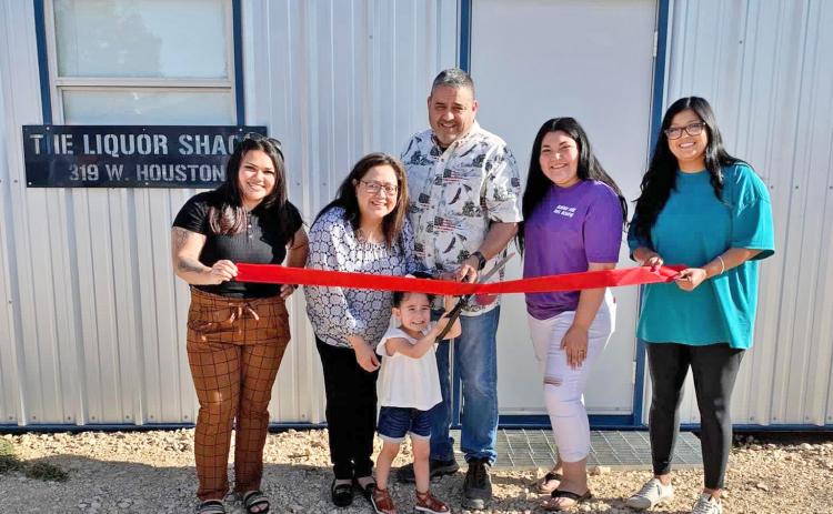 BREW THROUGH The new Liquor SHACK in Floydada, a drive-through shop, held a ribbon cutting Thursday, May 4. From left are Elizabeth Rodriguez, Carol Perez, Ariel Perez, Alfred Perez, Sarah Perez, and Yelitza Serrato.