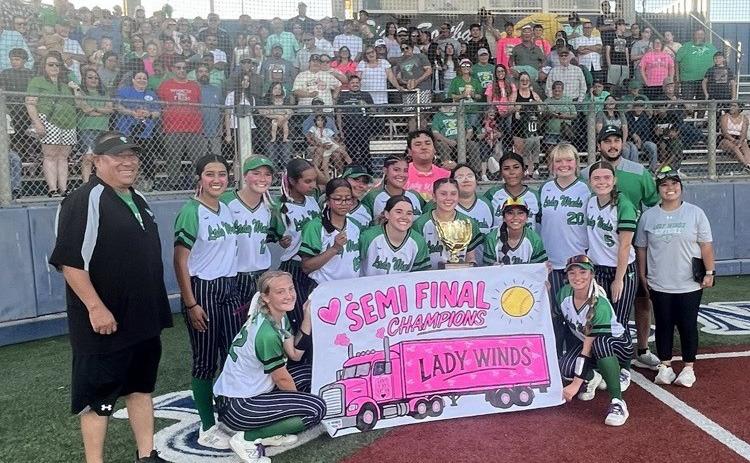 GOLDEN GLOW Members of the Lady Winds softball team hoist the semifinal trophy after taking two games of three against Colorado City May 7. They’ll face Cisco next Saturday for a chance at the State championship. | JOSE CARILLO PHOTO